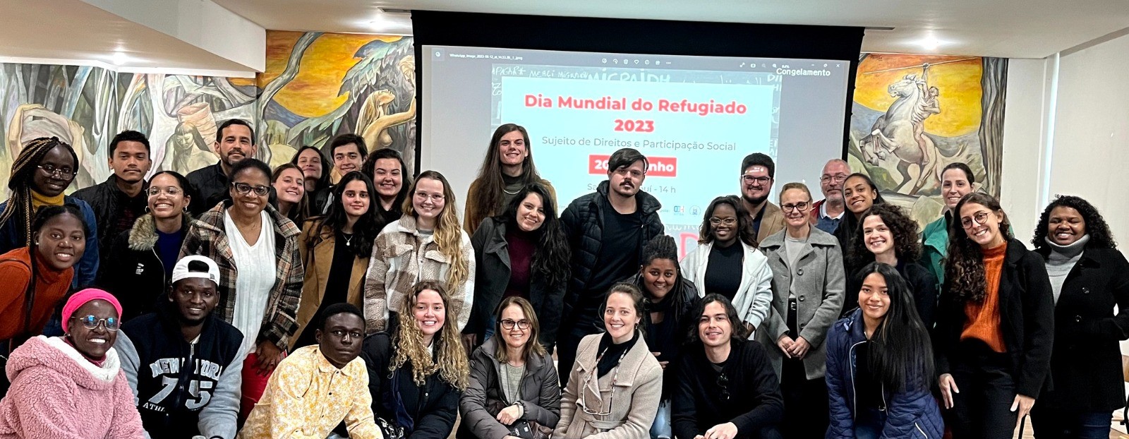 Equipe do Migraidh e participantes no encerramento do evento do Dia Mundial do Refugiado